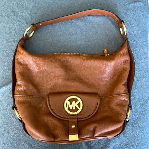 Are mk bags real leather hotsell